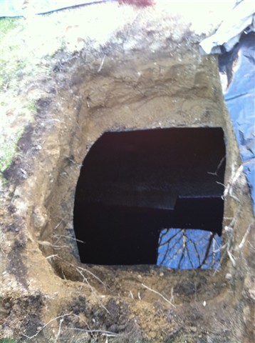 Cut tank open, remove fill and vent pipe. Pump out tank of fuel.