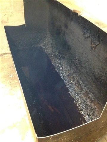 Tank is pumped out of any left over oil and cut open.